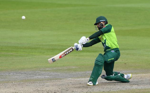 Cricket - Second T20 International - England v Pakistan - Emirates Old Trafford, Manchester, Britain - August 30, 2020 Pakistan's Mohammad Hafeez in action as he is caught out by England's Eoin Morgan Mike Hewitt/Pool via REUTERS (REUTERS)