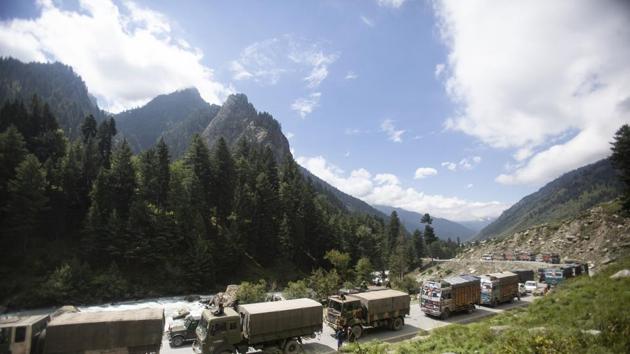An Indian army convoy moves on the Srinagar- Ladakh highway at Gagangeer, northeast of Srinagar, India. (AP)