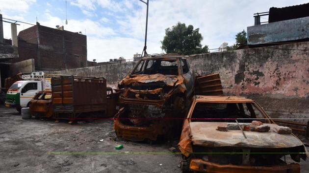 Damaged vehicles which were set fire during the Delhi riots seen dumped inside a parking lot six months after the North-East Delhi riots, at Shiv Vihar, in New Delhi.(Sanchit Khanna/HT PHOTO) Damaged vehicles which were set fire during the Delhi riots seen dumped inside a parking lot six months after the North-East Delhi riots, at Shiv Vihar, in New Delhi.(Sanchit Khanna/HT PHOTO)