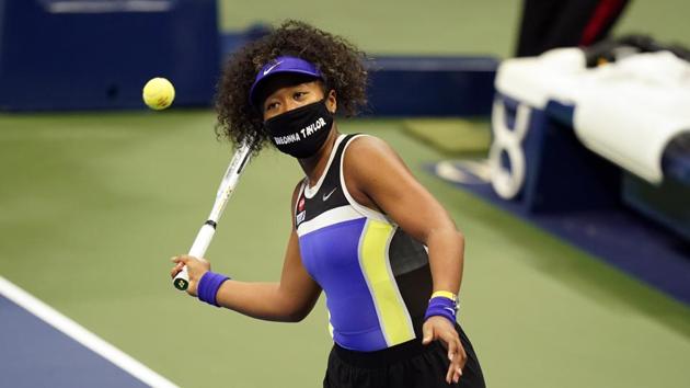 Naomi Osaka, of Japan, wears a mask in honor of Breonna Taylor as she celebrates after defeating Misaki Doi, of Japan, during the first round of the US Open tennis championships, Monday, Aug. 31, 2020, in New York. (AP Photo/Frank Franklin II)(AP)