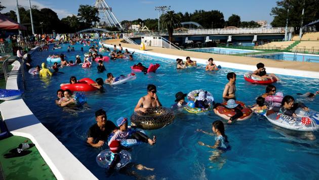 Visitors enjoy doughnut-shaped pool, amid the coronavirus disease (COVID-19) outbreak, at Toshimaen amusement park which will close 94 years after it first opened with part of the site to be turned into a new Harry Potter theme park in 2023, in Tokyo, Japan. (REUTERS/Issei Kato)
