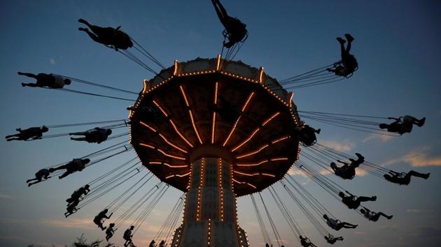 Visitors enjoy an attraction, amid the coronavirus disease (COVID-19) outbreak, at Toshimaen amusement park which will close 94 years after it first opened with part of the site to be turned into a new Harry Potter theme park in 2023, in Tokyo, Japan August 9, 2020. (REUTERS/Issei Kato)