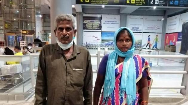 Gulf migrant Neela Yellaiah along with his wife Rajavva in Hyderabad International Airport.(HT photo)