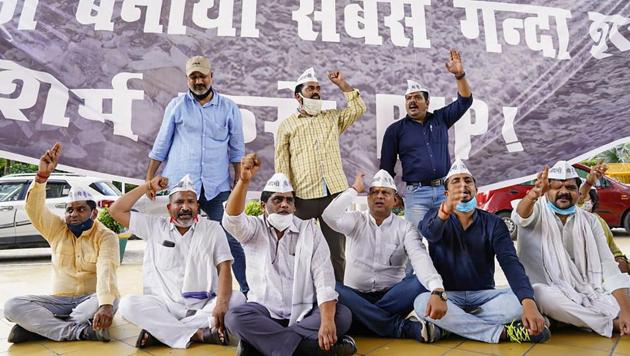 Aam Aadmi Party members stage a protest against alleged corruption in the BJP-ruled municipal corporations, in New Delhi. Tuesday, Sept. 1, 2020. (PTI photo) Aam Aadmi Party members stage a protest against alleged corruption in the BJP-ruled municipal corporations, in New Delhi. Tuesday, Sept. 1, 2020. (PTI photo)