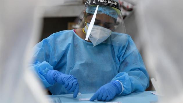 A health worker works with samples collected for rapid testing to detect Covid-19 infection at Nehru Homoeopathic Medical College and Hospital in New Delhi on August 31. India began September 2 with 78,357 new cases of the coronavirus disease which have pushed the nationwide tally to 3,769,523, the Union health ministry’s dashboard shows with data for the previous 24 hours. (Sonu Mehta / HT Photo) A health worker works with samples collected for rapid testing to detect Covid-19 infection at Nehru Homoeopathic Medical College and Hospital in New Delhi on August 31. India began September 2 with 78,357 new cases of the coronavirus disease which have pushed the nationwide tally to 3,769,523, the Union health ministry’s dashboard shows with data for the previous 24 hours. (Sonu Mehta / HT Photo)