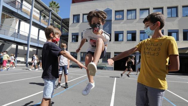 Secondary school students play in the courtyard at the College Henri Matisse school in Nice, France on September 1. The students return at a time when infections rates are spiralling upwards across the continent and there are widespread concerns that the return to schools and offices, the autumn flu season and excess mortality in winter could drive a second wave. (Eric Gaillard / REUTERS) Secondary school students play in the courtyard at the College Henri Matisse school in Nice, France on September 1. The students return at a time when infections rates are spiralling upwards across the continent and there are widespread concerns that the return to schools and offices, the autumn flu season and excess mortality in winter could drive a second wave. (Eric Gaillard / REUTERS)