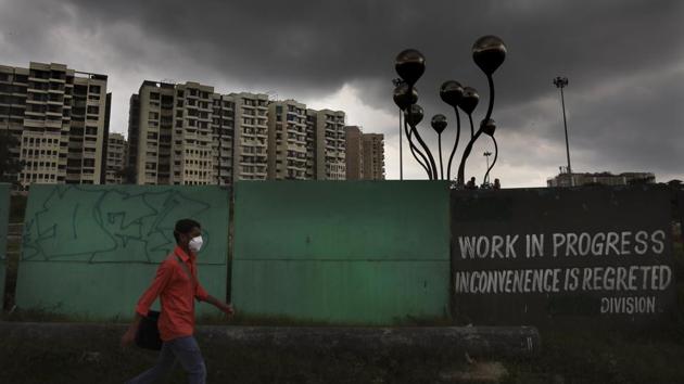 A man wearing a mask walks past a construction site in New Delhi on August 30. According to the Delhi government the third survey will also ensure an adequate mix of people living in rural and urban areas and in recognised and unrecognised colonies as they plan to collect samples from all 272 municipal wards in the city, barring those who have already been sampled. (Manish Swarup / AP) A man wearing a mask walks past a construction site in New Delhi on August 30. According to the Delhi government the third survey will also ensure an adequate mix of people living in rural and urban areas and in recognised and unrecognised colonies as they plan to collect samples from all 272 municipal wards in the city, barring those who have already been sampled. (Manish Swarup / AP)