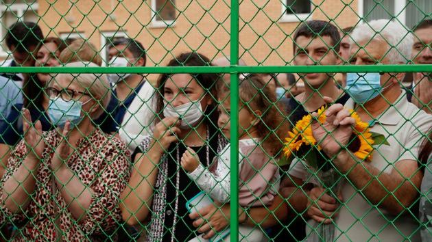 Relatives watch from behind a fence as first graders attend a ceremony marking the start of the new academic year in Moscow, Russia on September 1. Pupils returned to school in Russia as the country’s coronavirus case tally climbed past 1 million. (Evgenia Novozhenina / REUTERS) Relatives watch from behind a fence as first graders attend a ceremony marking the start of the new academic year in Moscow, Russia on September 1. Pupils returned to school in Russia as the country’s coronavirus case tally climbed past 1 million. (Evgenia Novozhenina / REUTERS)