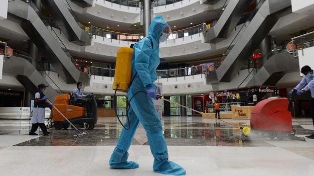 A worker in PPE coveralls sanitises the floor of a shopping mall that reopened in Chennai on September 1. The number of active cases in the country has reached 8,01,282, and the figure for those discharged from hospitals stands at 29,01,908 –a gap of 21,00,626. (Arun Sankar / AFP) A worker in PPE coveralls sanitises the floor of a shopping mall that reopened in Chennai on September 1. The number of active cases in the country has reached 8,01,282, and the figure for those discharged from hospitals stands at 29,01,908 –a gap of 21,00,626. (Arun Sankar / AFP)