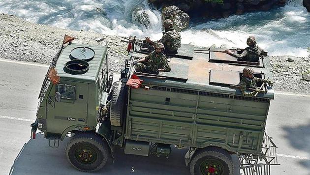 Army personnel on the Srinagar-Ladakh highway at Gagangeer in Srinagar on Wednesday.