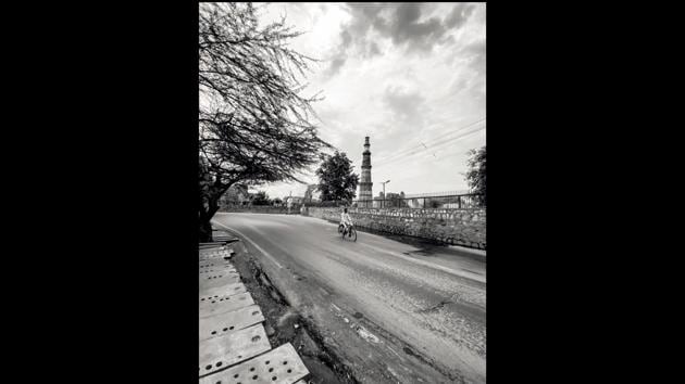 “Delhi’s oldest beacon of history, Qutub Minar where every child went on a school picnic, looks as forlorn and desolate as the lone cyclist pedalling during the first two weeks of the lockdown,” says Parul Sharma, the author of “Dialects of Silence: Delhi Under Lockdown.” (Parul Sharma)