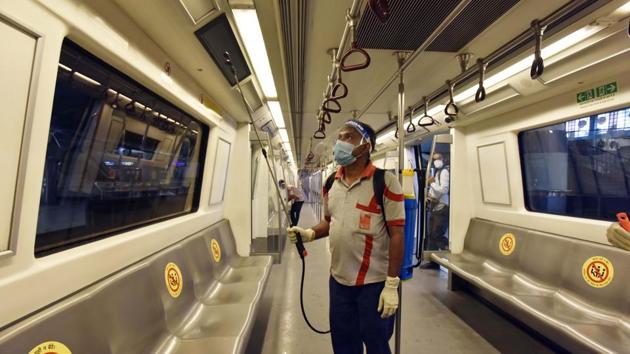 A DMRC worker sanitizes a coach at Rajiv Chowk Metro Station in New Delhi on September 3. Under the Unlock 4 plan, the Delhi Metro, which comprises 389km of the 678km of Metro lines in the country, will be monitored closely initially and reviewed after a week, HT quoted Union Minister for Housing and Urban Affairs Hardeep Singh Puri on September 2. (Sanjeev Verma / HT Photo) A DMRC worker sanitizes a coach at Rajiv Chowk Metro Station in New Delhi on September 3. Under the Unlock 4 plan, the Delhi Metro, which comprises 389km of the 678km of Metro lines in the country, will be monitored closely initially and reviewed after a week, HT quoted Union Minister for Housing and Urban Affairs Hardeep Singh Puri on September 2. (Sanjeev Verma / HT Photo)