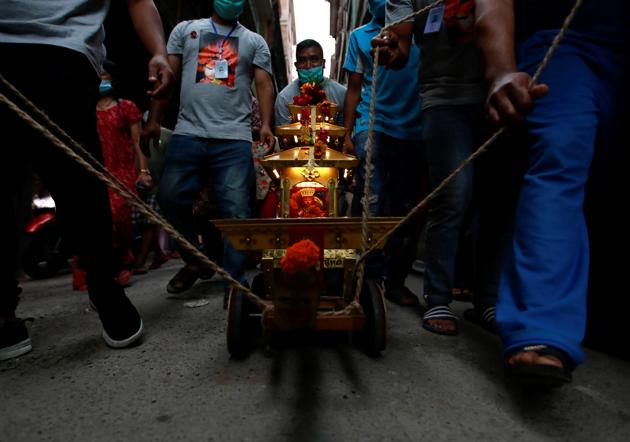 Devotees carry the miniature chariot of the Living Goddess Kumari during the annual festival of Indra Jatra as the official celebration has been cancelled due to the spread of the coronavirus disease (COVID-19) in Kathmandu, Nepal September 2, 2020. (REUTERS) Devotees carry the miniature chariot of the Living Goddess Kumari during the annual festival of Indra Jatra as the official celebration has been cancelled due to the spread of the coronavirus disease (COVID-19) in Kathmandu, Nepal September 2, 2020. (REUTERS)