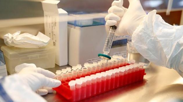 A scientist filters out samples during the research and development of a vaccine against the coronavirus disease. (Reuters) A scientist filters out samples during the research and development of a vaccine against the coronavirus disease. (Reuters)