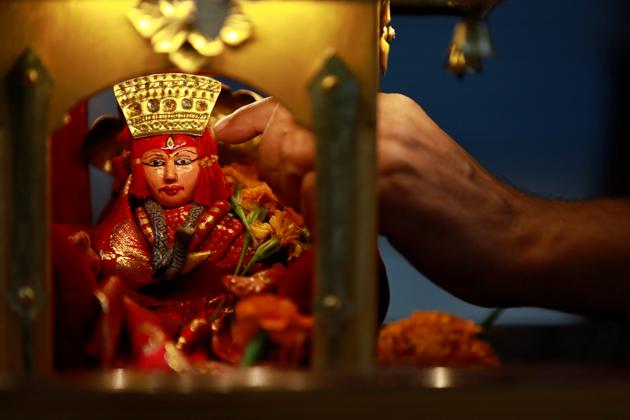 An idol of the Living Goddess Kumari is pictured inside the miniature chariot kept on display during the annual festival of Indra Jatra as the official celebration has been cancelled due to the spread of the coronavirus disease (COVID-19) in Kathmandu, Nepal September 2, 2020. (REUTERS) An idol of the Living Goddess Kumari is pictured inside the miniature chariot kept on display during the annual festival of Indra Jatra as the official celebration has been cancelled due to the spread of the coronavirus disease (COVID-19) in Kathmandu, Nepal September 2, 2020. (REUTERS)