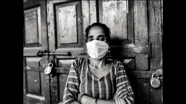The gentle courtesans of G.B. Road, Delhi’s red light street, stare into space struggling to survive without customers. (Parul Sharma)