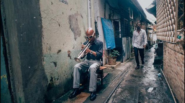 A musician plays in a narrow alley, just off Bazzar Street in Bandra, Mumbai. (Gopal MS)