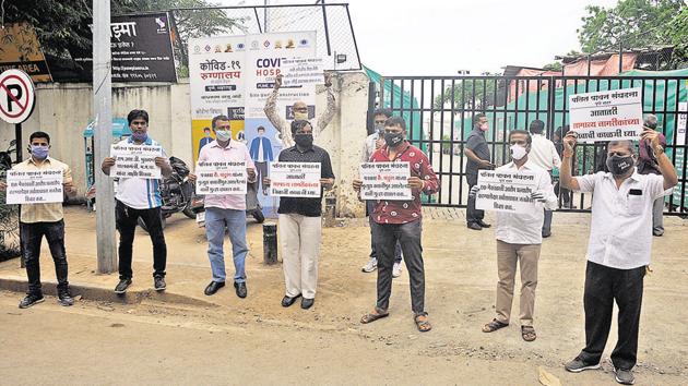 Members of Pawan Sanghatna, protest at jumbo Covid-19 facility, at COEP, Shivajinagar in Pune, on Thursday.(HT PHOTO)