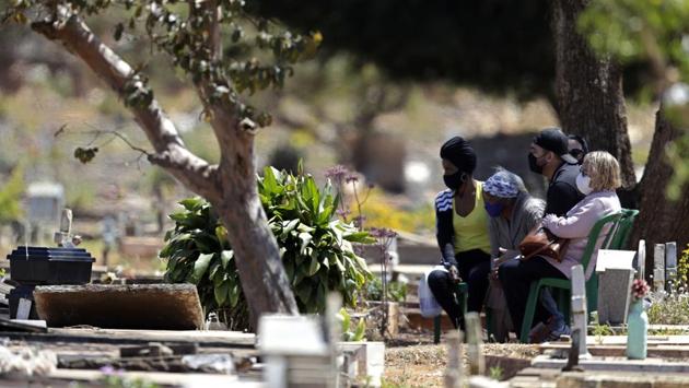 Family members attend the burial of Luzia Paulina Santos, 82, who they say died of Covid-19, at the Campo da Esperanca cemetery in the Taguatinga neighbourhood of Brasilia, on September 3. Since the first case came to light on February 26, the South American colossus has registered more than 4.04 million infections and over 124,600 deaths, second only to the United States. (Eraldo Peres / AP) Family members attend the burial of Luzia Paulina Santos, 82, who they say died of Covid-19, at the Campo da Esperanca cemetery in the Taguatinga neighbourhood of Brasilia, on September 3. Since the first case came to light on February 26, the South American colossus has registered more than 4.04 million infections and over 124,600 deaths, second only to the United States. (Eraldo Peres / AP)
