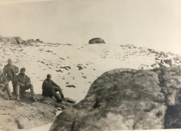 Some men from the patrol at Billi Post, with the author wearing a turban and snow goggles (sitting). A Chinese bunker can be seen in the background.(Courtesy: Author’s own)