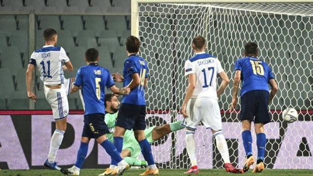 Bosnia Herzegovina’s Edin Dzeko, left, scores during the UEFA Nations League football match between Italy and Bosnia Herzegovina(AP Photo)