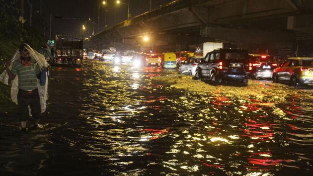 In Delhi, rains led to heavy waterlogging, which disrupted traffic movement on key roads. (PTI photo) In Delhi, rains led to heavy waterlogging, which disrupted traffic movement on key roads. (PTI photo)