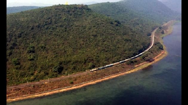 A bird’s eye view of a train along the Chilika Lake.(Twitter@RailMinIndia)