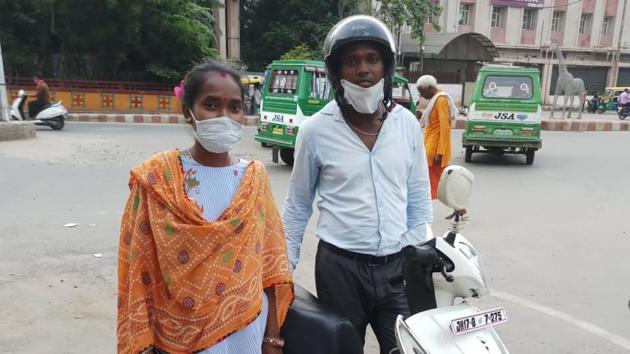 Dhanajay Kumar and his wife with their two-wheeler in Gwalior in Madhya Pradesh. (HT Photo) Dhanajay Kumar and his wife with their two-wheeler in Gwalior in Madhya Pradesh. (HT Photo)