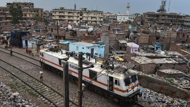 A locomotive runs past slums adjoining railway tracks in New Delhi on September 3. India is increasingly becoming the main force fuelling the global Covid-19 tally. The country reached 2-million cases on August 7. It took 16 more days to record the next 1 million cases. It took India just 12 days for the tally to breach the 4-million mark, HT reported. (Sanchit Khanna / HT Photo) A locomotive runs past slums adjoining railway tracks in New Delhi on September 3. India is increasingly becoming the main force fuelling the global Covid-19 tally. The country reached 2-million cases on August 7. It took 16 more days to record the next 1 million cases. It took India just 12 days for the tally to breach the 4-million mark, HT reported. (Sanchit Khanna / HT Photo)