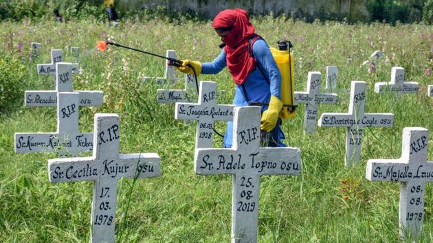 A municipal worker sanitises a Roman Catholic Church graveyard after the burial of a Covid-19 victim in Ranchi on September 6. The death toll in India due to Covid-19 rose to 71,642 on September 7 after 1,016 more deaths were recorded in the last 24 hours. (AFP) A municipal worker sanitises a Roman Catholic Church graveyard after the burial of a Covid-19 victim in Ranchi on September 6. The death toll in India due to Covid-19 rose to 71,642 on September 7 after 1,016 more deaths were recorded in the last 24 hours. (AFP)