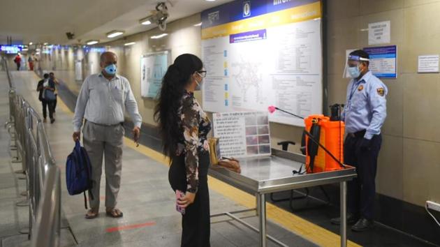 Passengers at the metro station as Delhi Metro services resume. (Amal KS/HT)