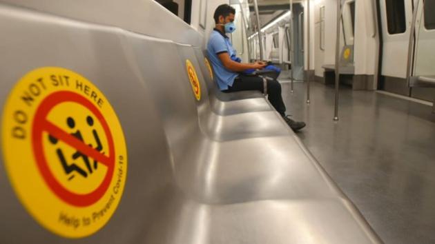 Covid-19 awareness sticker indicating the seat should be left unoccupied on the Delhi Metro. (Amal KS/HT)