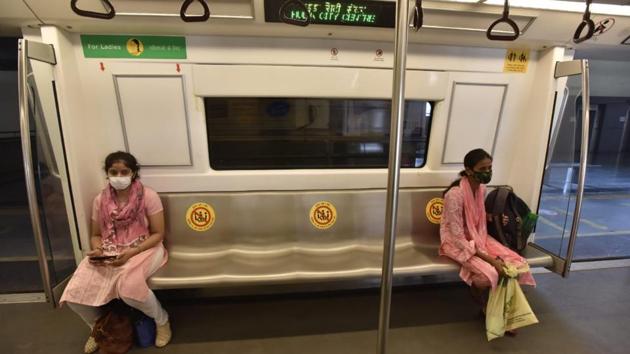 Passengers sit at a distance in the Delhi Metro as services are resumed. (Sanjeev Verma/HT)