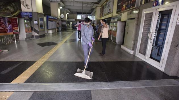 Sanitisation in progress at one of the open stations as Delhi Metro resumes services. (Sanjeev Verma/HT)