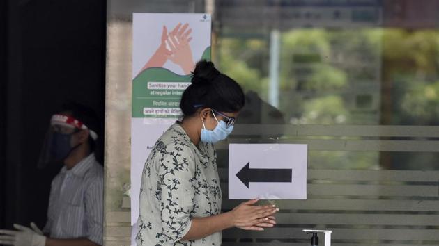 A student sanitizes her hands while exiting after sitting for the Delhi University (DU) entrance exam, at New Delhi Institute fro Information Technology & Management, in Kalkaji, New Delhi. (Sanjeev Verma/HT PHOTO) A student sanitizes her hands while exiting after sitting for the Delhi University (DU) entrance exam, at New Delhi Institute fro Information Technology & Management, in Kalkaji, New Delhi. (Sanjeev Verma/HT PHOTO)