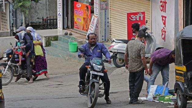 People violating wearing mask norms in a containment zone in Santoshnagar, Katraj. (Ravindra Joshi/HT) People violating wearing mask norms in a containment zone in Santoshnagar, Katraj. (Ravindra Joshi/HT)