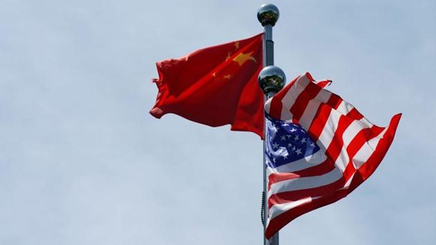 Chinese and US flags flutter near The Bund, before US trade delegation meet their Chinese counterparts for talks in Shanghai, China.(REUTERS) Chinese and US flags flutter near The Bund, before US trade delegation meet their Chinese counterparts for talks in Shanghai, China.(REUTERS)