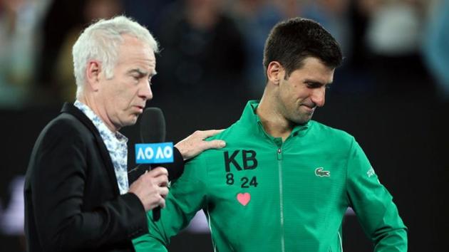 Serbia's Novak Djokovic reacts after his match against Canada's Milos Raonic as he is interviewed by former tennis player John McEnroe.(REUTERS)