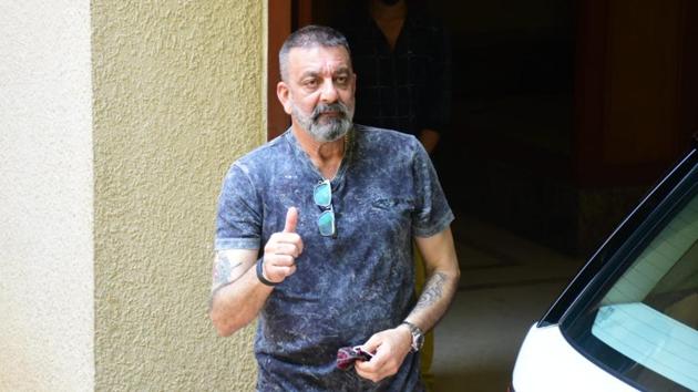 Actor Sanjay Dutt, who is being treated for lung cancer, gestures to the paparazzi. (Varinder Chawla)