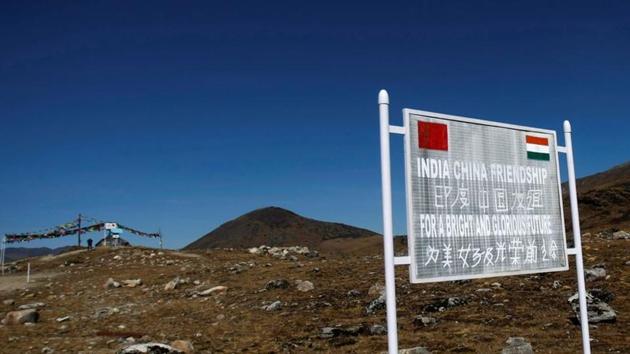A signboard is seen from the Indian side of the Indo-China border at Bumla, in the northeastern Indian state of Arunachal Pradesh.(REUTERS) A signboard is seen from the Indian side of the Indo-China border at Bumla, in the northeastern Indian state of Arunachal Pradesh.(REUTERS)