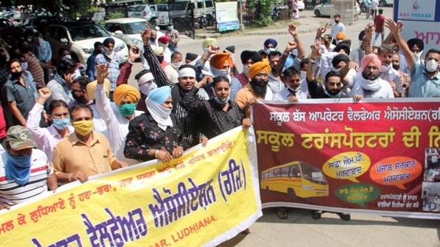 Members of School Bus Operators’ Welfare Association protesting against the state government outside the deputy commissioner’s office in Ludhiana on Tuesday. They have threatened to intensify their protests if their demands are not met.(Gurpreet Singh/HT)