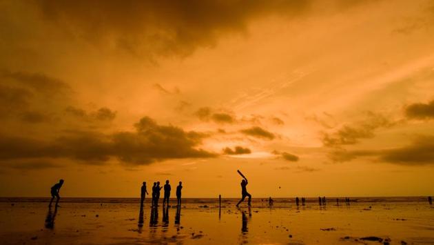 People play cricket at sunset on Juhu Beach in Mumbai on September 7. With 16,429 new cases recorded between September 7 and 8 morning, a relative drop from the past few days, Maharashtra’s Covid-19 stood at 923,641 total cases with 27,027 deaths. (Satyabrata Tripathy / HT Photo)
