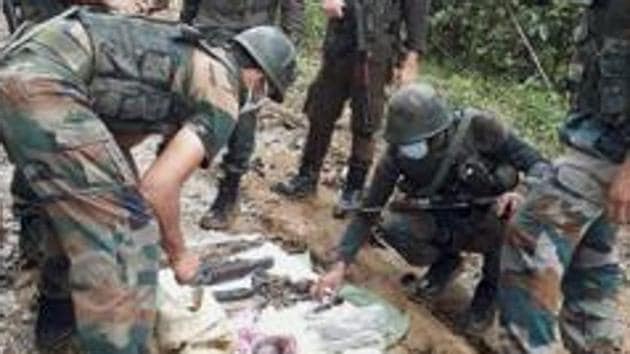 In a joint operation with Jammu and Kashmir Police and CRPF, Indian Army recovered cache of arms and arrested two people. (PTI Photo/Representative) In a joint operation with Jammu and Kashmir Police and CRPF, Indian Army recovered cache of arms and arrested two people. (PTI Photo/Representative)