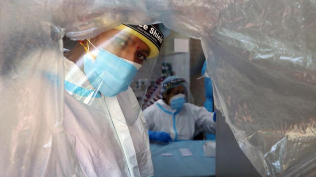 Health workers while conducting Covid-19 RT-PCR tests at a government-run dispensary in New Delhi on September 8. A record 74,894 patients recovered in the previous 24 hours, the health bulletin on September 9 said, taking the total number of people to have made recoveries to 33,98,844. There are currently 8,97,394 active cases in the country. (T. Narayan / Bloomberg) Health workers while conducting Covid-19 RT-PCR tests at a government-run dispensary in New Delhi on September 8. A record 74,894 patients recovered in the previous 24 hours, the health bulletin on September 9 said, taking the total number of people to have made recoveries to 33,98,844. There are currently 8,97,394 active cases in the country. (T. Narayan / Bloomberg)