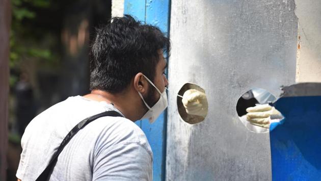 A health worker collects a swab sample from a man for coronavirus testing at Patparganj Dispensary in New Delhi on September 9. Attributing the spike in cases to the increased testing, “From 18,000-20,000 tests per day, we are now conducting around 40,000 tests. So, more people are getting identified, treated and isolated to prevent them from spreading the infection to others,” Delhi Chief Minister Arvind Kejriwal told HT. (Raj K Raj /HT Photo) A health worker collects a swab sample from a man for coronavirus testing at Patparganj Dispensary in New Delhi on September 9. Attributing the spike in cases to the increased testing, “From 18,000-20,000 tests per day, we are now conducting around 40,000 tests. So, more people are getting identified, treated and isolated to prevent them from spreading the infection to others,” Delhi Chief Minister Arvind Kejriwal told HT. (Raj K Raj /HT Photo)