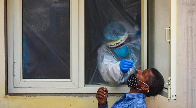 A health worker takes a swab sample from a man for a coronavirus test, in Defence Colony, New Delhi, India, on Wednesday, September 9, 2020. (Amal KS/HT PHOTO) A health worker takes a swab sample from a man for a coronavirus test, in Defence Colony, New Delhi, India, on Wednesday, September 9, 2020. (Amal KS/HT PHOTO)