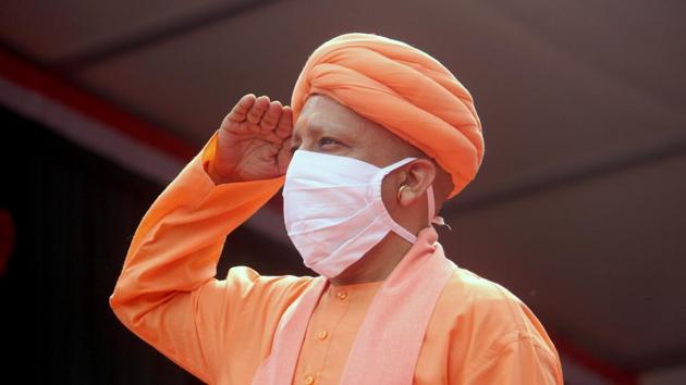 Uttar Pradesh Chief Minister Yogi Adityanath salutes after hoisting the tricolor flag on the occasion of 74th Independence Day celebration at Vidhan Bhawan in Lucknow on Saturday. (ANI Photo)(ANI)