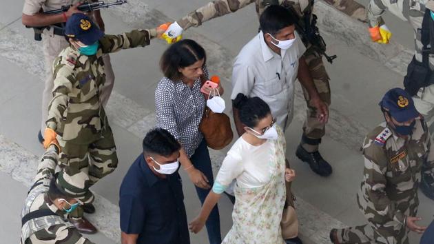Security personnel accompany Kangana Ranaut at Chandigarh International Airport. (Photo by Gurminder Singh/Hindustan Times) Security personnel accompany Kangana Ranaut at Chandigarh International Airport. (Photo by Gurminder Singh/Hindustan Times)