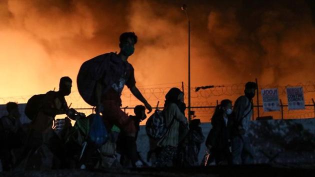 Some 12,500 people were living at the Moria camp and the surrounding area, where additional restrictions have been imposed over the past week after a Somali resident tested positive for the coronavirus.(Reuters Photo) Some 12,500 people were living at the Moria camp and the surrounding area, where additional restrictions have been imposed over the past week after a Somali resident tested positive for the coronavirus.(Reuters Photo)