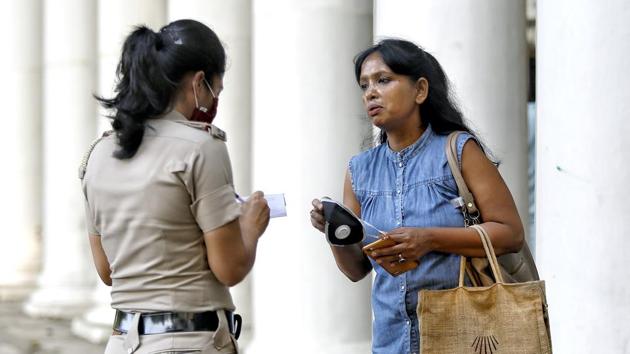 A police official fines a woman for not wearing a face mask in public at Connaught Place in New Delhi on September 8. Moving on from a strict check on individuals to adhere to precautions in public, the government officials now plan to execute an intensive awareness campaign wherein pre-recorded audio messages will be sent to at least 1 crore phone numbers of Delhi residents to reinstate the importance of testing, HT reported. (ANI) A police official fines a woman for not wearing a face mask in public at Connaught Place in New Delhi on September 8. Moving on from a strict check on individuals to adhere to precautions in public, the government officials now plan to execute an intensive awareness campaign wherein pre-recorded audio messages will be sent to at least 1 crore phone numbers of Delhi residents to reinstate the importance of testing, HT reported. (ANI)